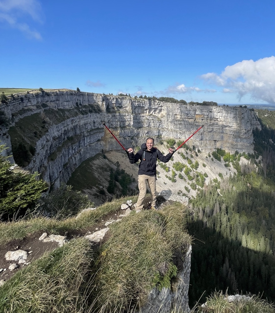 Alpine hike with cliff backdrop